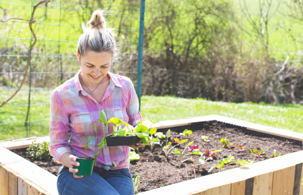 person sitting on garden bed